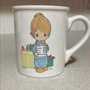 Precious Moments Mug with Child Design “Love Never Fails”